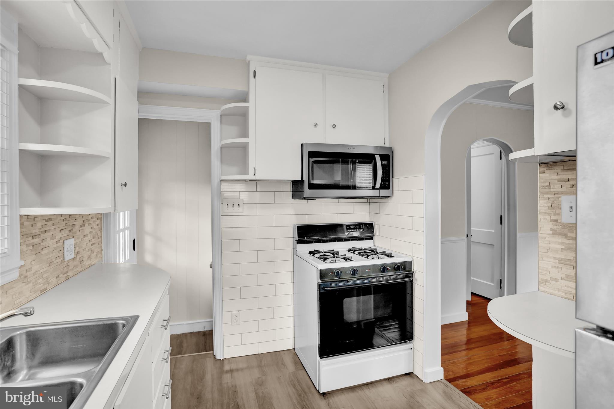 4710 Perkiomen Avenue Reading, PA 19606 - Photo 15 of 39 a kitchen with stainless steel appliances a stove a sink and a microwave