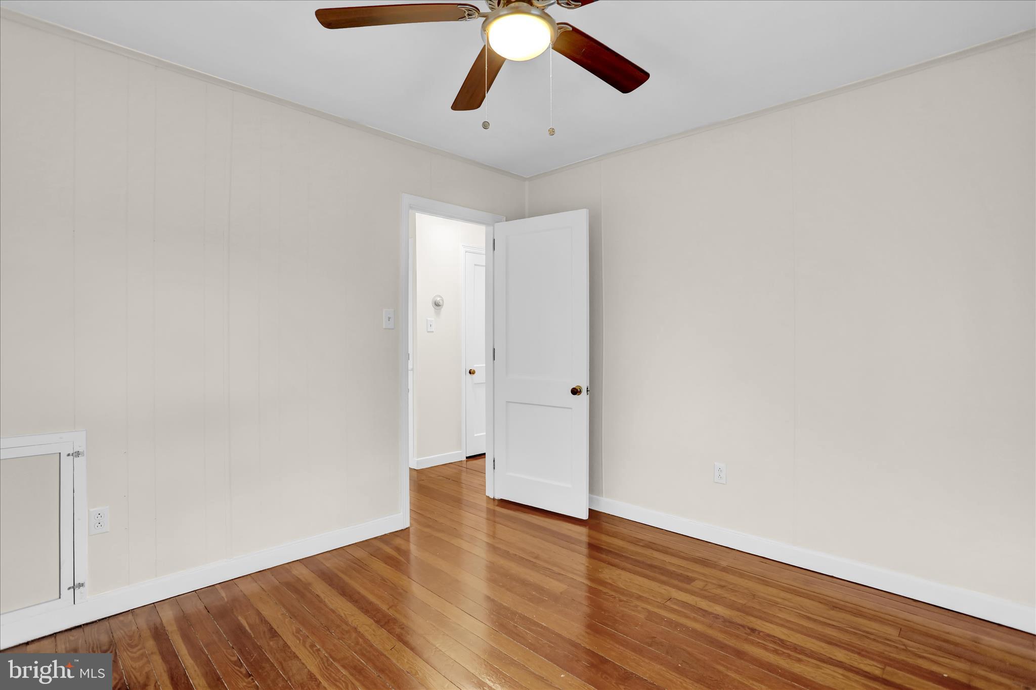 4710 Perkiomen Avenue Reading, PA 19606 - Photo 17 of 39 a view of empty room with wooden floor