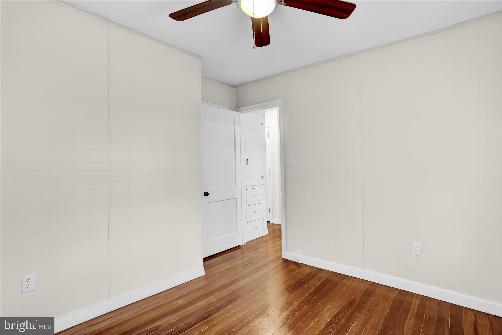 4710 Perkiomen Avenue Reading, PA 19606 - Photo 18 of 39 a view of an empty room with wooden floor