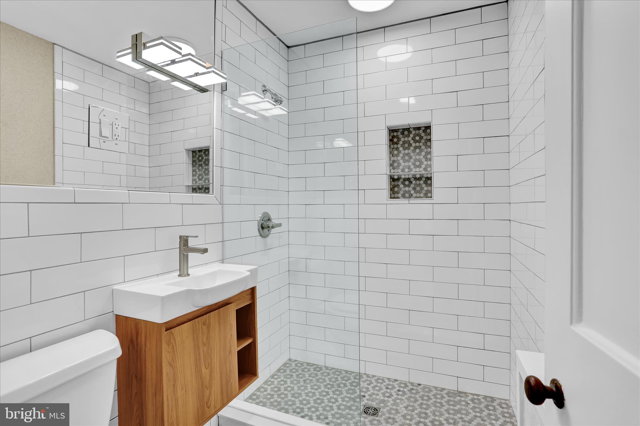 4710 Perkiomen Avenue Reading, PA 19606 - Photo 21 of 39 a bathroom with a sink a toilet and shower