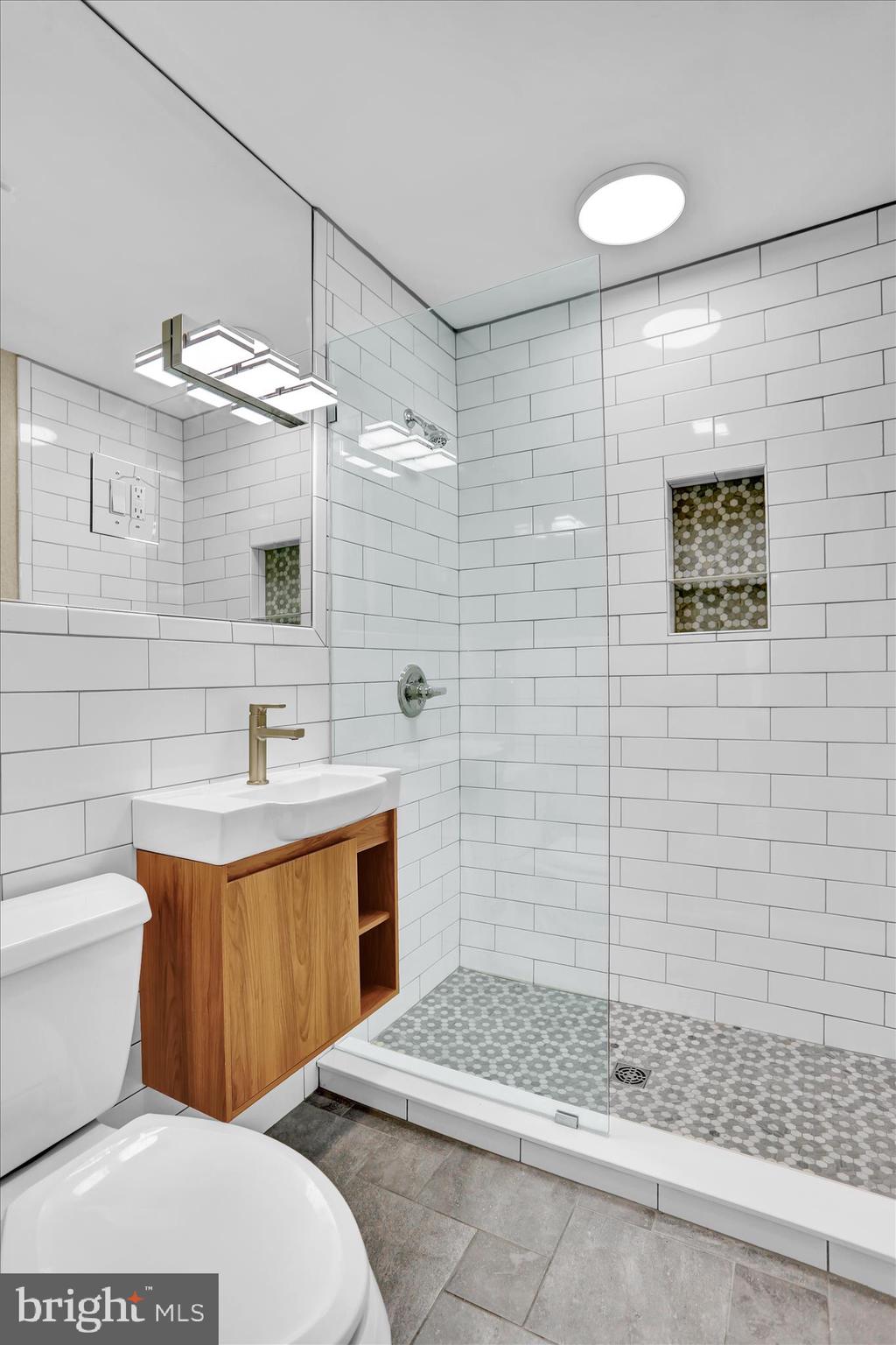 4710 Perkiomen Avenue Reading, PA 19606 - Photo 22 of 39 a bathroom with a sink a toilet and shower