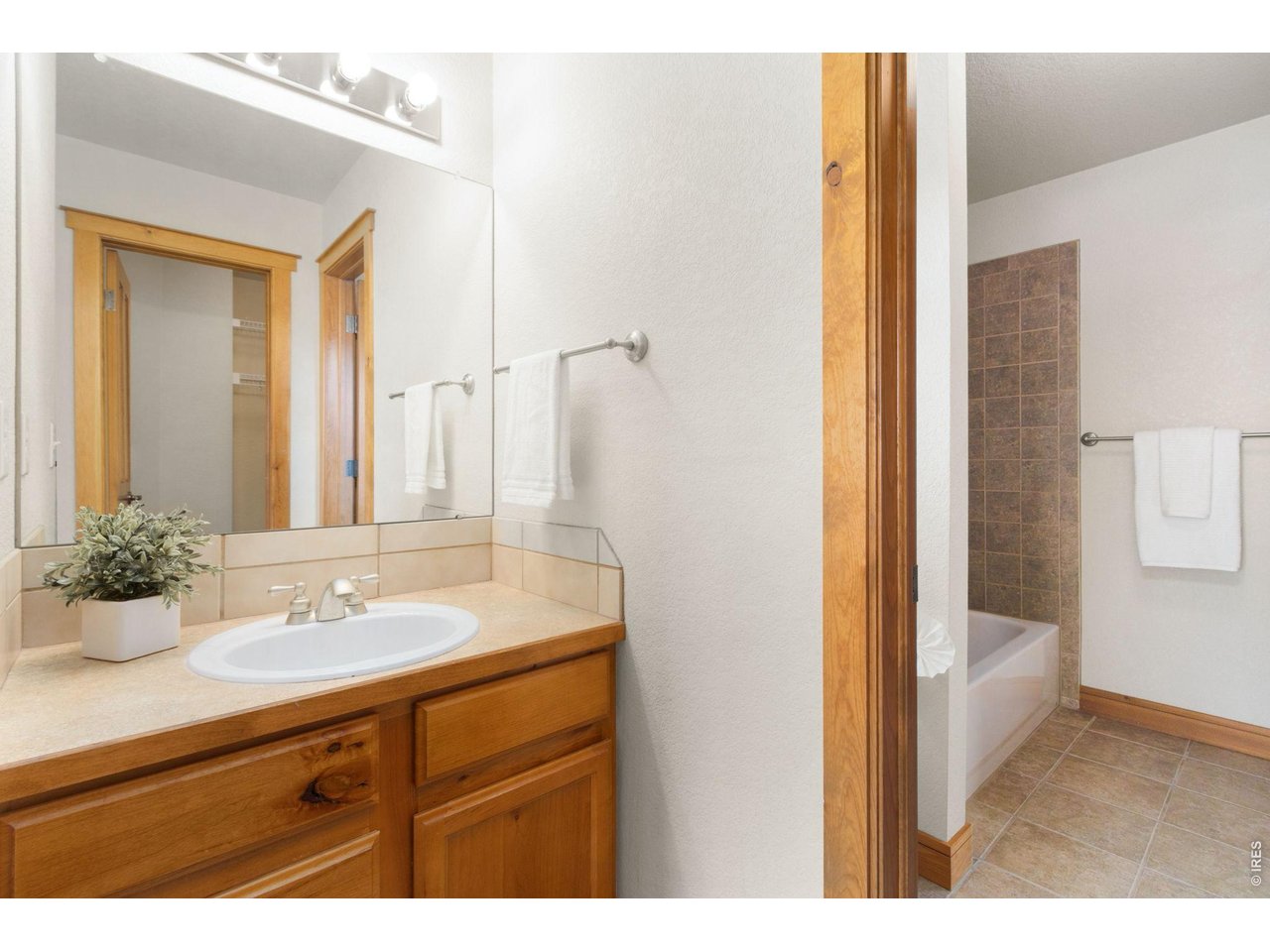 4226 Rolling Gate Road Fort Collins, CO 80526 - Photo 21 of 37 Jack And Jill Bathroom between bedrooms 3 and 4 offers individual, private sinks and water closets.