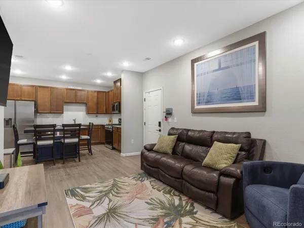 a bedroom with furniture and a flat screen tv