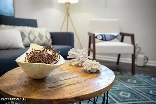 a living room with furniture and a table