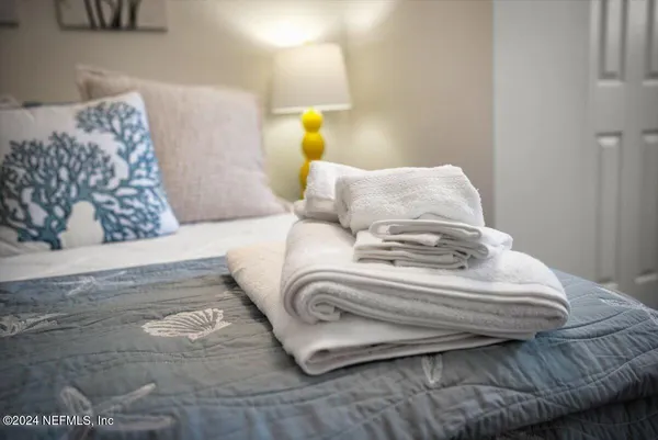 a bedroom with a bed and couch