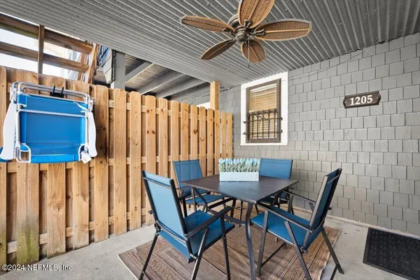 a view of a dining room with furniture and a window