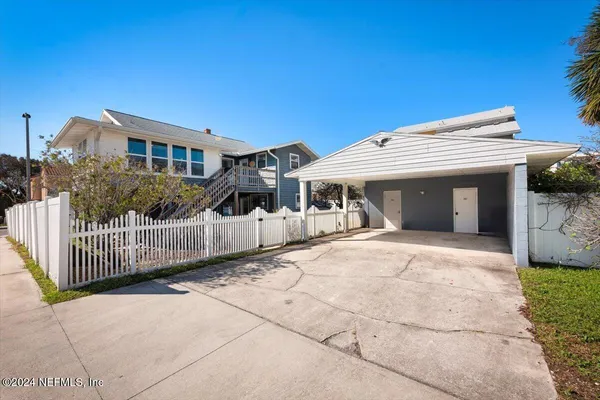 a front view of a house with a garage