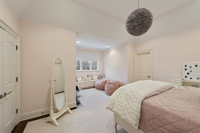 98 Woodley Road Winnetka, IL 60093 - Photo 12 of 21 a bedroom with a bed and a chandelier