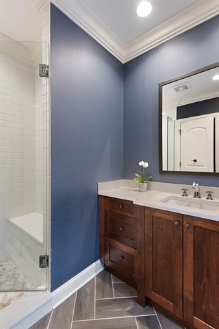 98 Woodley Road Winnetka, IL 60093 - Photo 17 of 21 a bathroom with a double vanity sink and a mirror