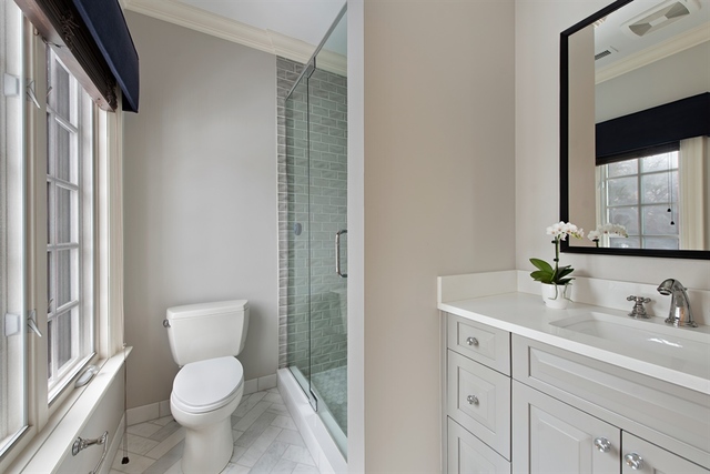 98 Woodley Road Winnetka, IL 60093 - Photo 19 of 21 a white toilet sitting next to a bathroom sink