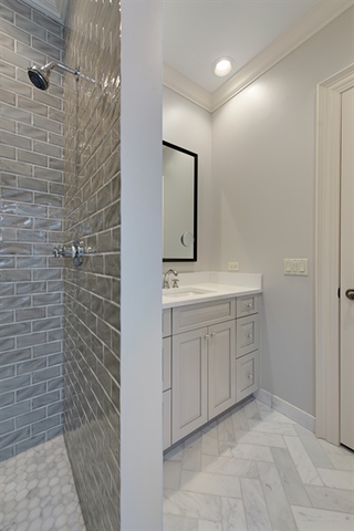 98 Woodley Road Winnetka, IL 60093 - Photo 20 of 21 a bathroom with a sink and a mirror