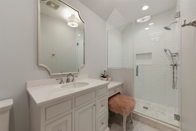 98 Woodley Road Winnetka, IL 60093 - Photo 21 of 21 a bathroom with a sink and a mirror