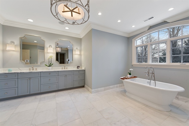 98 Woodley Road Winnetka, IL 60093 - Photo 7 of 21 a spacious bathroom with a double vanity sink a mirror and a bathtub