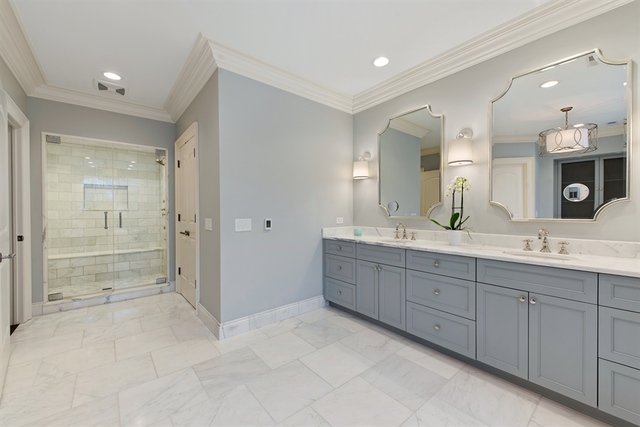 98 Woodley Road Winnetka, IL 60093 - Photo 9 of 21 a bathroom with a granite countertop sink mirror and shower