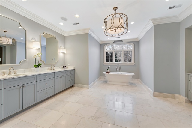 98 Woodley Road Winnetka, IL 60093 - Photo 10 of 21 a spacious bathroom with a sink a mirror and a bathtub
