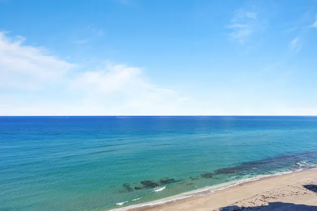 an aerial view of beach and ocean