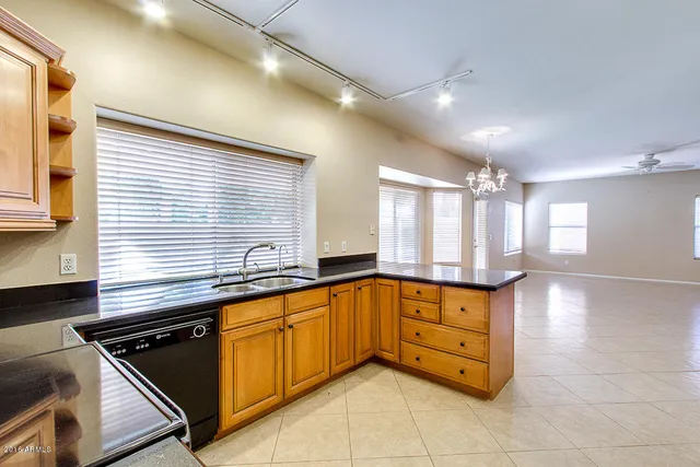 a kitchen with a sink and cabinets