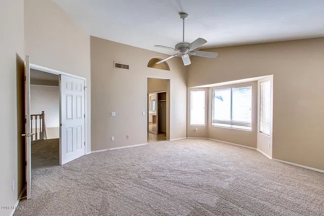 a view of an empty room with a window