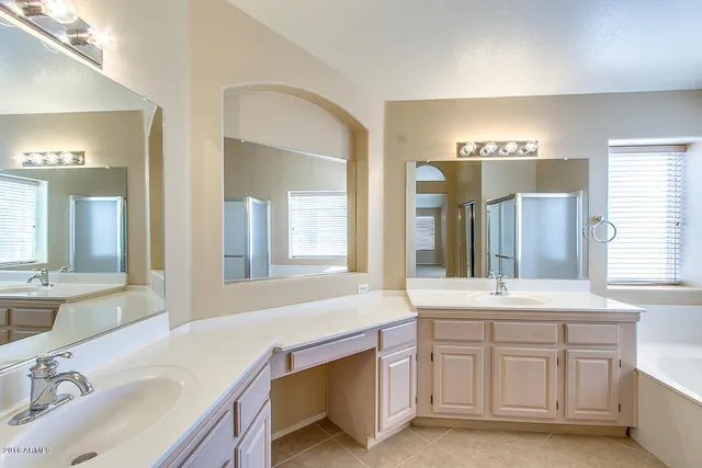 a bathroom with a sink and a large mirror