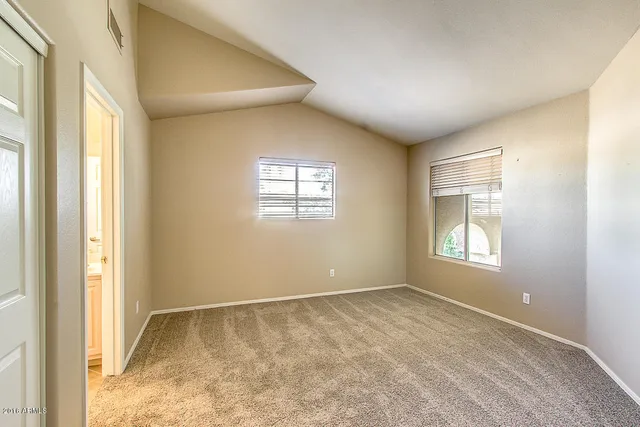 a view of empty room with windows