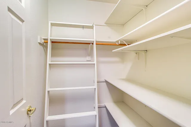 a view of an empty walk in closet