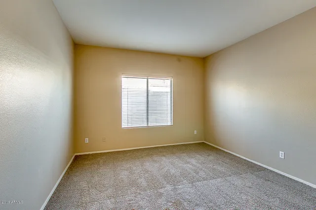 a bathroom with a sink toilet and a mirror