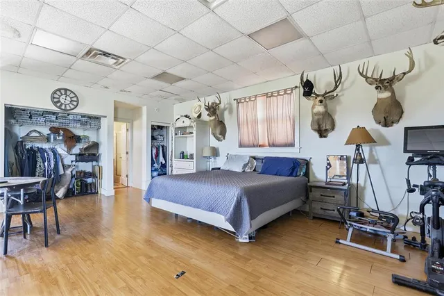 a bedroom with a bed and cabinets