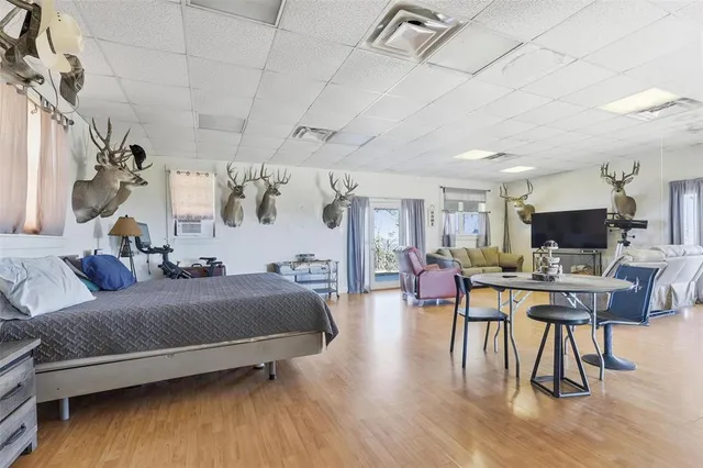 a bedroom with a bed and a table