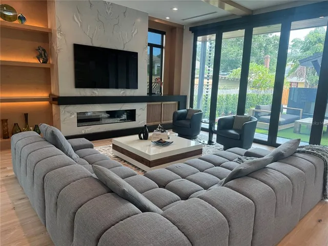 a kitchen with kitchen island a sink appliances and cabinets