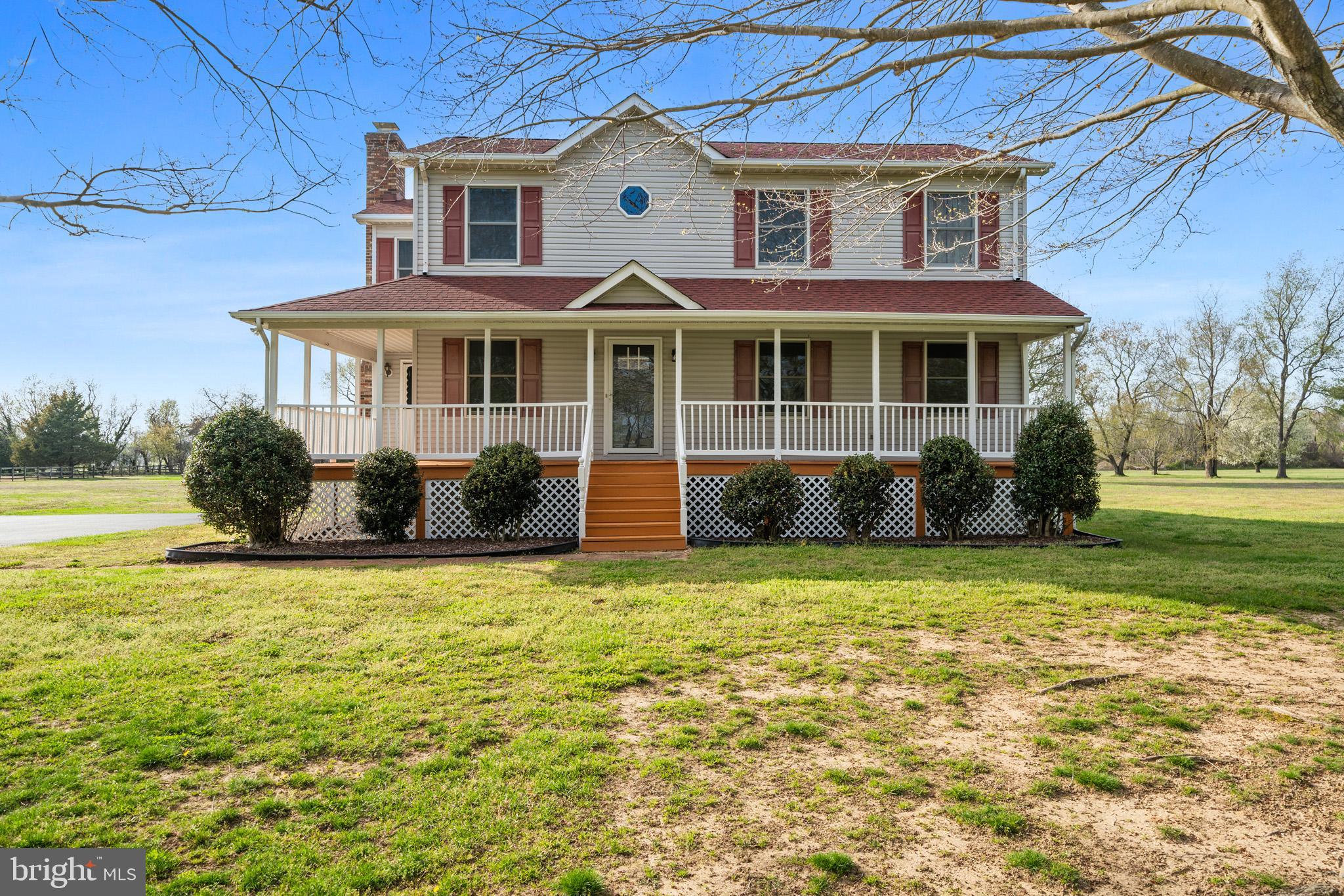 4355 Leitches Wharf Road Prince Frederick, MD 20678 - Photo 2 of 58 a front view of a house with a garden