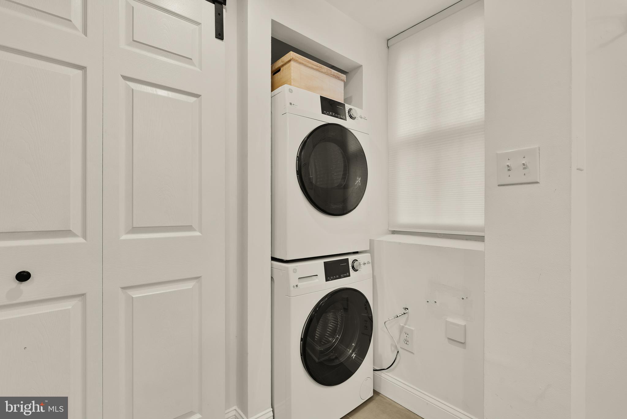 2370 Champlain Street Northwest, Unit 21 Washington, DC 20009 - Photo 16 of 22 a utility room with dryer and washer