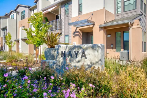 a view of a house with a flower garden