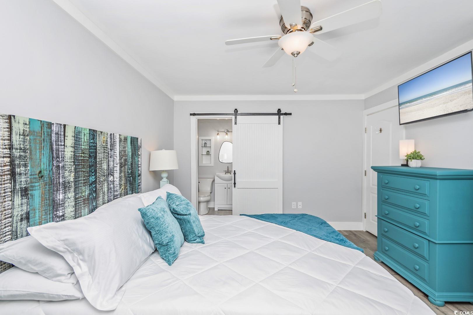 21 Pine Valley Lane Surfside Beach, SC 29575 - Photo 23 of 40 Bedroom with ensuite bathroom, crown molding, ligh