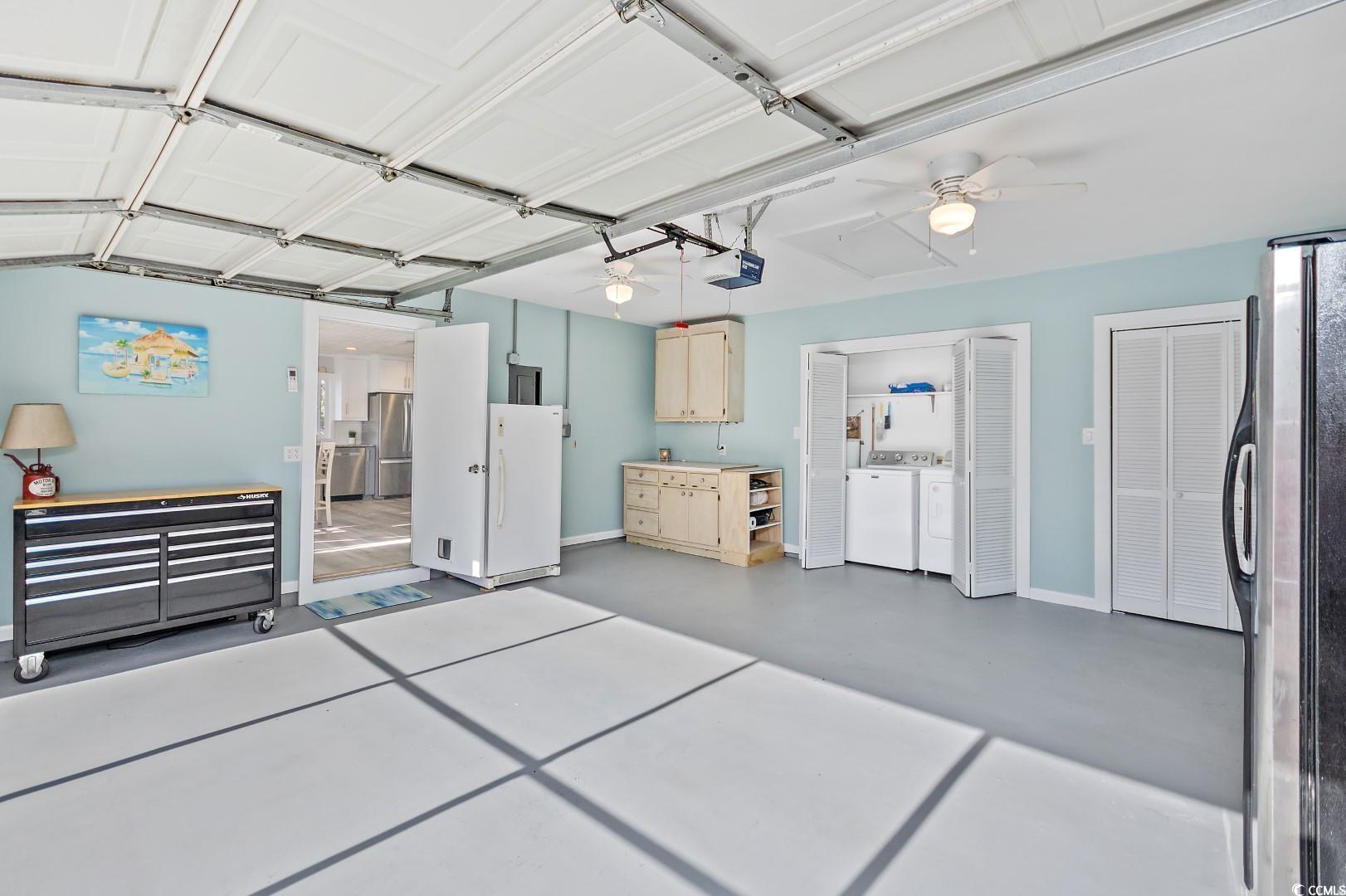 21 Pine Valley Lane Surfside Beach, SC 29575 - Photo 33 of 40 Garage featuring ceiling fan, stainless steel frid