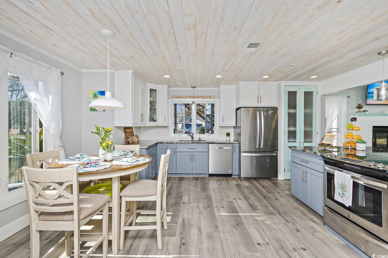 21 Pine Valley Lane Surfside Beach, SC 29575 - Photo 5 of 40 Kitchen featuring white cabinets, wood ceiling, de