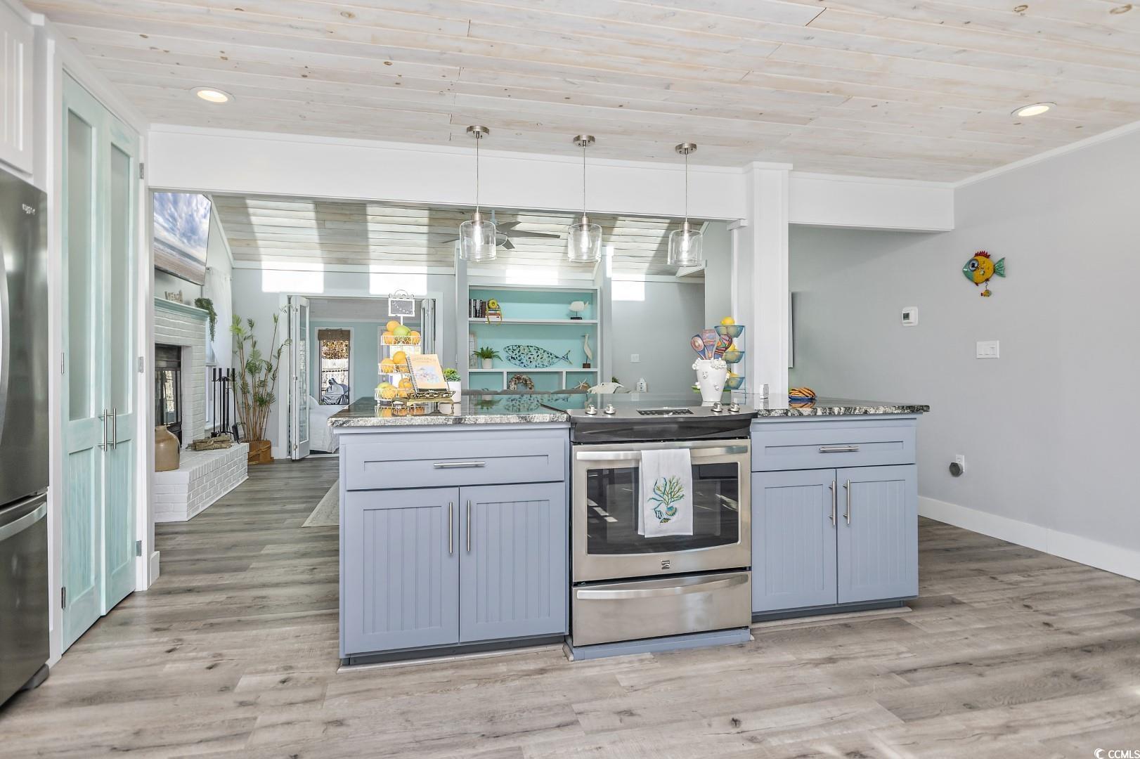 21 Pine Valley Lane Surfside Beach, SC 29575 - Photo 9 of 40 Kitchen featuring decorative light fixtures, stain