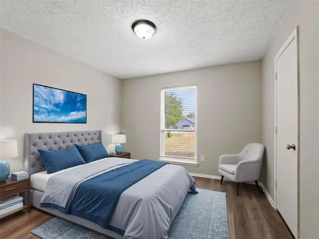 a bedroom with a bed and a couch