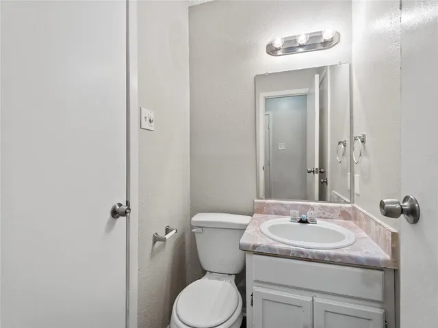 a bathroom with a sink and toilet