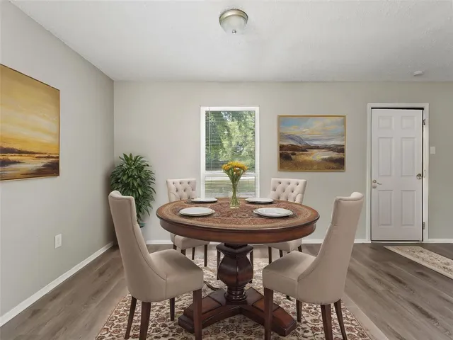 a dining room with furniture and window