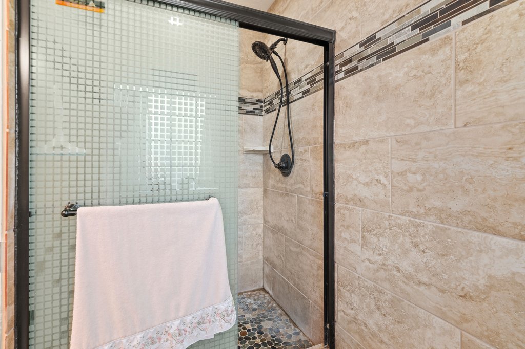 1843 Farm To Market 969 Elgin, TX 78621 - Photo 15 of 28 a bathroom with a shower