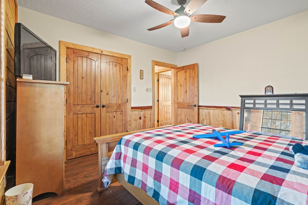 1843 Farm To Market 969 Elgin, TX 78621 - Photo 18 of 28 a bedroom with a bed and a chandelier