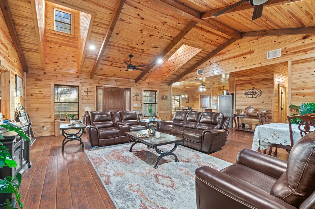 1843 Farm To Market 969 Elgin, TX 78621 - Photo 2 of 28 a living room with furniture and a chandelier