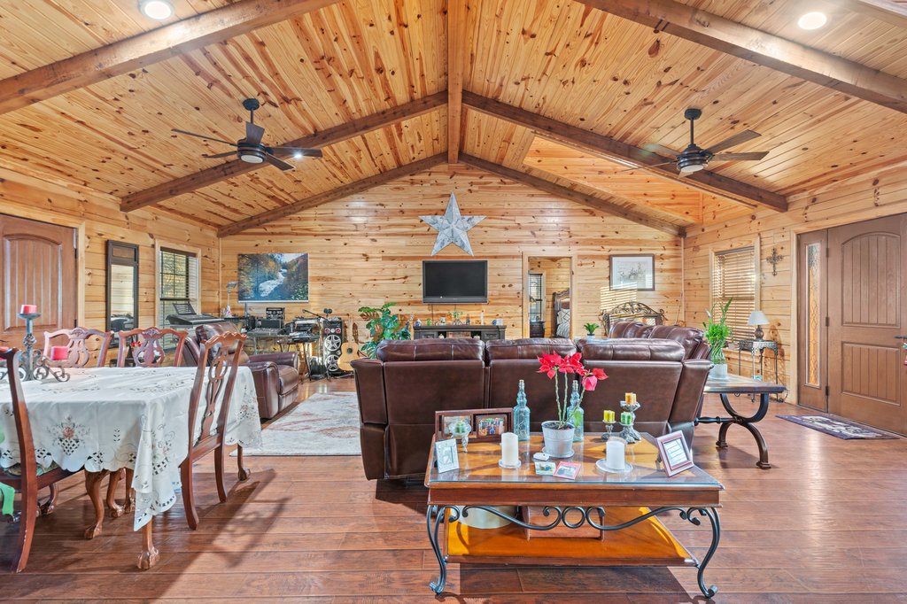 1843 Farm To Market 969 Elgin, TX 78621 - Photo 6 of 28 a living room with furniture a flat screen tv and a table
