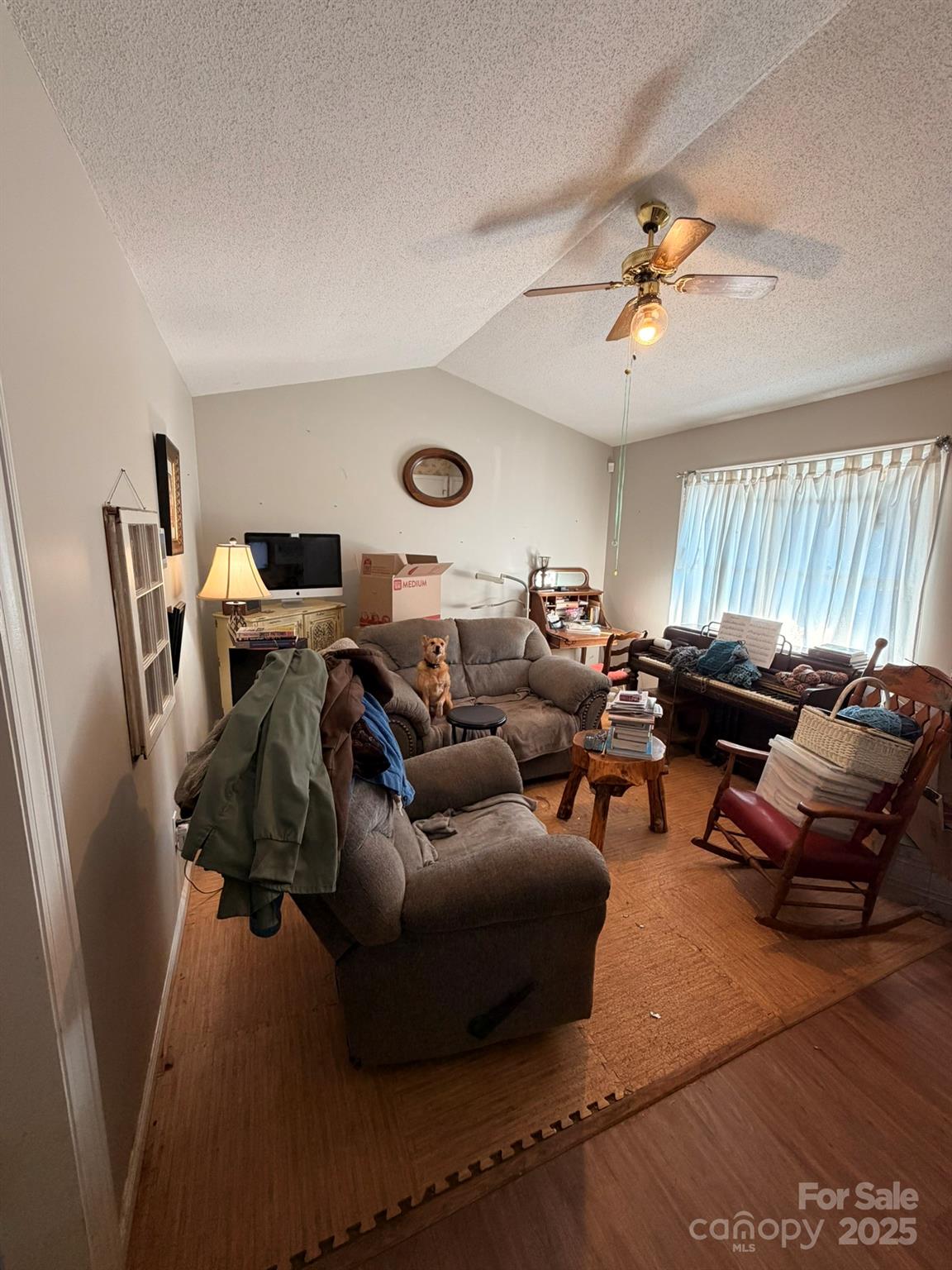 284 Jennings Road North Wilkesboro, NC 28659 - Photo 4 of 11 a living room with furniture a clock and a window