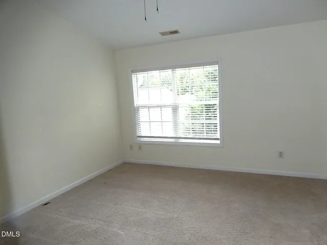 a bathroom with a double vanity sink mirror and toilet