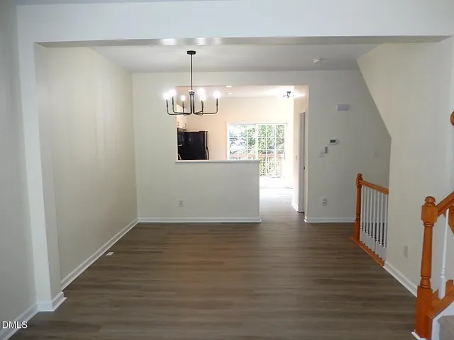 a view of a livingroom with wooden floor