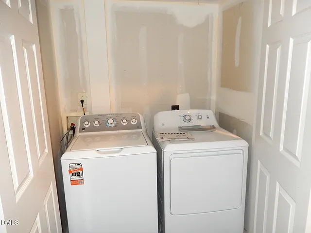 a view of a chairs and table in the patio