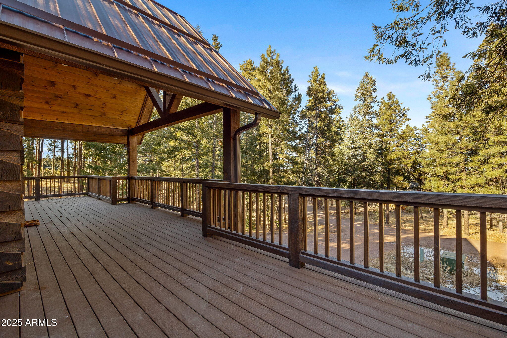 90 North 1330th Road Greer, AZ 85927 - Photo 13 of 44 a view of balcony with wooden floor