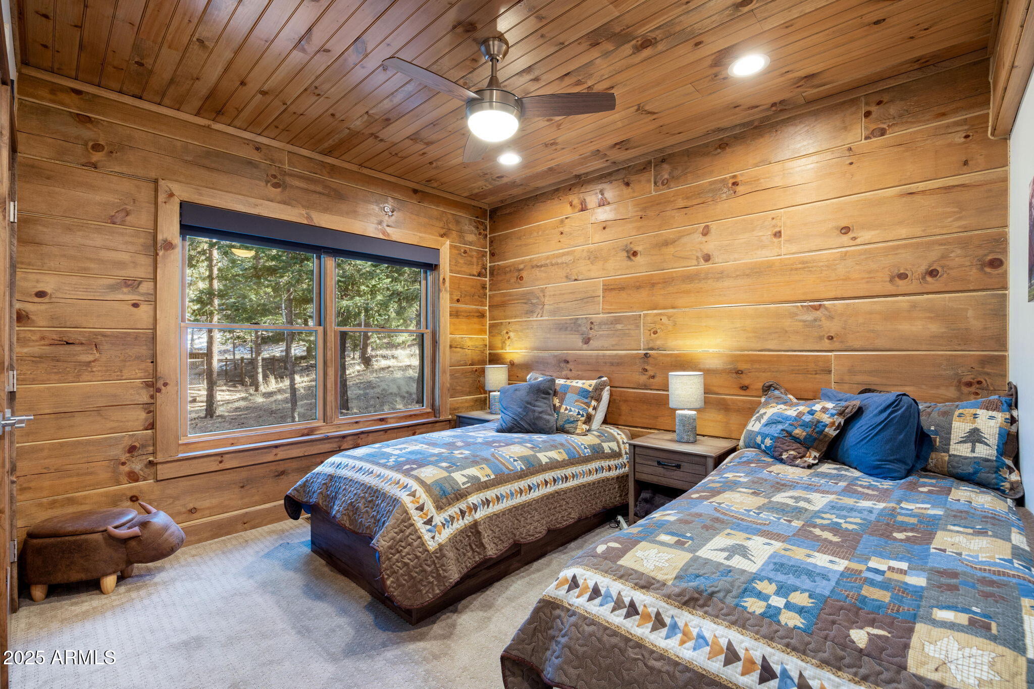 90 North 1330th Road Greer, AZ 85927 - Photo 31 of 44 a bedroom with two beds and a chandelier