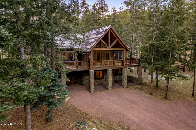 a backyard of a house with barbeque oven table and chairs